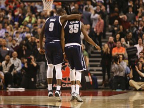 Serge Ibaka throws an arm around Kevin Durant after his teammate sunk a three-pointer -- his 51st point of the night -- late in double OT to defeat the Raptors 119-118. (Jack Boland, Toronto Sun)