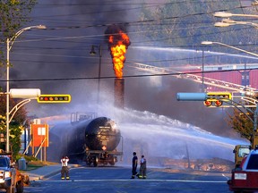 Fire from a train explosion is seen in Lac-Megantic, Quebec on July 6, 2013 after a 74 car runaway freight train carrying crude oil derailed in the centre of the city of resulting in forty-two people confirmed dead with 5 more missing and presumed dead. Roughly half of the downtown area buildings were destroyed. The train was owned by Montreal, Maine and Atlantic Railway Corp (MMA). KARL TREMBLAY/ /QMI AGENCY