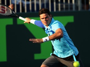 Milos Raonic of Canada runs in to play a forehand against Jack Sock of the United States during their second round match during day 6 at the Sony Open at Crandon Park Tennis Center on March 22, 2014 in Key Biscayne, Florida. (Clive Brunskill/Getty Images/AFP)