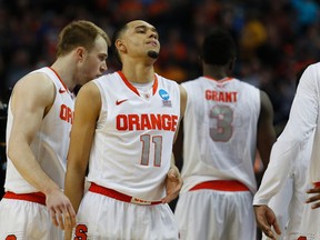 Brampton's Tyler Ennis walks off the court after Syracuse lost to Dayton at the NCAA tournament in Buffalo on March 22. (Timothy T. Ludwig-USA TODAY Sports)