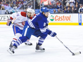 Phil Kessel of the Maple Leafs tries to get away from Canadiens' Tomas Plekanec on March 22. (Ernest Doroszuk, Toronto Sun)