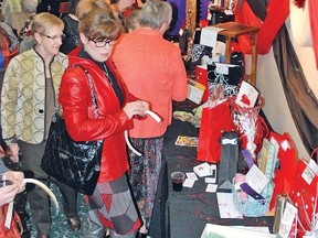 The community showed tremendous support for the Vulcan Kinettes inaugural Paint the Night Red fundraiser held the night of Saturday, March 22 at the Vulcan Legion. Here, people line up to check out prizes.