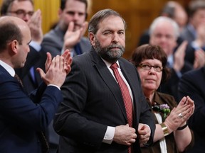 New Democratic Party leader Thomas Mulcair winks while receiving a standing ovation from his caucus during Question Period in the House of Commons on Parliament Hill in Ottawa March 5, 2014. REUTERS/Chris Wattie