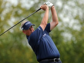 Colin Montgomerie of Scotland hits his drive on the 7th hole during the final round of the 3M Championship at TPC Twin Cities on August 4, 2013 in Blaine, Minnesota. (Steve Dykes/Getty Images/AFP)