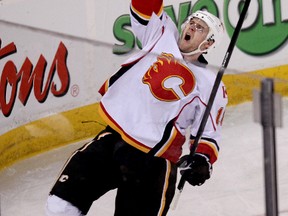 Calgary Flames Matt Stajan (18) celebrates scoring a penalty shot goal against Edmonton Oilers goalie Viktor Fasth (35) during second period NHL action at Rexall Place, in Edmonton Alta., on Saturday March 22, 2014. (David Bloom/QMI Agency)