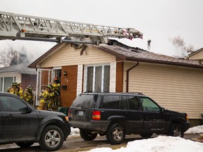 A house fire Sunday afternoon at 53 Stroud Crescent in London, Ont. on Sunday, March 23, 2014 forced three people from the home. (MIKE HENSEN, The London Free Press)