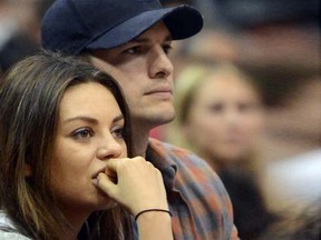 Mila Kunis and fiance Ashton Kutcher watch the game between the Clippers and Pistons at the Staples Center, Saturday, March 22, 2014, in Los Angeles. (Jayne Kamin-Oncea-USA TODAY Sports)