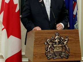 Dave Hancock makes a speech after being is sworn in as Alberta's new premier during a ceremony at Government House, in Edmonton on Sunday. (DAVID BLOOM/Edmonton Sun)
