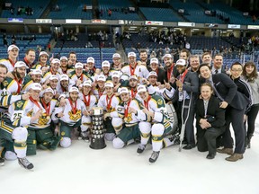 The University of Alberta Golden Bears celebrate with their trophy after winning the CIS national men's hockey championship on Sunday at the CIS Universoty Cup in Saskatoon. JOSH SCHAEFER/CIS University Cup