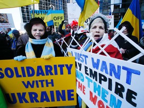 Ukrainian-Canadians protest the seizure of Crimea by Russia in front of the Russian consulate on Bloor St. Saturday. (Stan Behal/Toronto Sun)