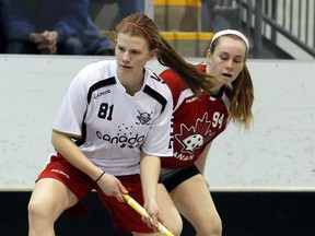Belleville athletes Hannah WIlson (81) and Brayden Irwin (94) compete in last weekend's exhibition floorball game at the Sports Centre between the Canadian U19 women and the Canadian senior women. (TIM MEEKS/The Intelligencer)