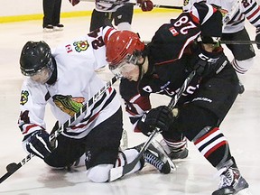 Picton Pirates centre Griffin McCarty battles a Lakefield Chiefs foe off the faceoff during Sunday's Schmalz Cup quarterfinal playoff game in Picton. (BRUCE BELL/The Intelligencer)