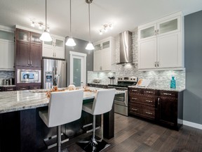 Colours and finishes balance for a kitchen that is truly dramatic.