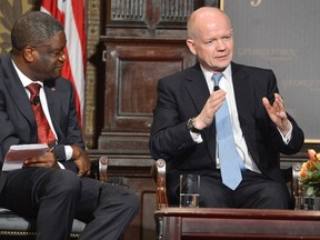 Britain's Foreign Secretary William Hague (right) makes remarks as Dr. Denis Mukwege listens after Hague and Mukwege were presented the Georgetown University's annual Hillary Rodham Clinton Award for Advancing Women in Peace and Security, at Georgetown University in Washington earlier this year. Mukwege was bestowed the Order of the Buffalo Hunt on Monday by Premier Greg Selinger. (REUTERS/Mike Theiler)