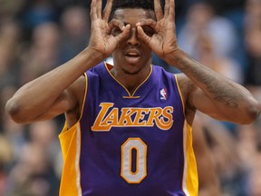 Los Angeles Lakers forward Nick Young (0) celebrates his three pointer in the fourth quarter against the Minnesota Timberwolves at Target Center. Minnesota wins 109-99 on Feb 4, 2014 in Minneapolis, MN, USA. (Brad Rempel/USA TODAY Sports)
