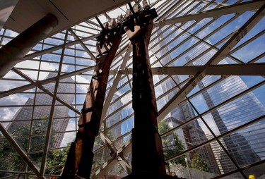 Two steel "tridents" recovered from the World Trade Center site after September 11, 2001, stand in the entry pavilion area of the 911 Memorial Museum, which is under construction, at the World Trade Center site in New York, July 2, 2013. The two "tridents rose from the base of the North Tower (1WTC) and were embedded in the bedrock branching from one column into three at the sixth floor of the tower. The 911 Memorial Museum is scheduled to be opened to the public in the Spring of 2014.   REUTERS/Mike Segar    (UNITED STATES - Tags: DISASTER BUSINESS CONSTRUCTION TPX IMAGES OF THE DAY)