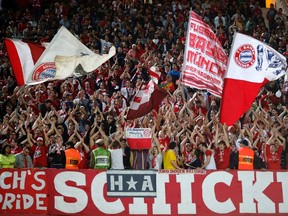 Fans chant and cheer during the FIFA Club World Cup soccer match between Guangzhou Evergrande and Bayern Munich at Agadir Stadium in Agadir December 17, 2013. (REUTERS/Ahmed Jadallah)