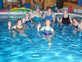 Lucknow's Barb Willits has a passion for teaching swimming year-round and has done so at her private pool for the past 20 years. Her Aquafit class on March 20, 2014 was all smiles while taking part in low-impact swimming exercises. Sepoy Swimmers owner Barb Willits is seen running swimmers through different activities. (TROY PATTERSON/KINCARDINE NEWS)