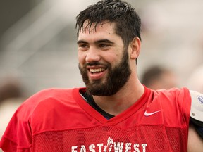 Laurent Duvernay-Tardif of McGill walks off the field after practice ahead of this year's college all-star East-West Shrine game on January, 15, 2014. (QMI Agency)