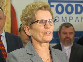 Premier Kathleen Wynne tells reporters on Monday, March 24, 2014, during a visit to a North York bakery company that she will not enter into public negotiations with the NDP for their budget support. (Antonella Artuso/Toronto Sun)