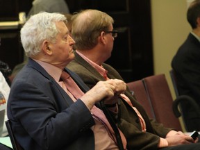 Former prime minister John Turner, a board member with Muileboom Organics Inc., and company president Marc Kealey listen to presentations Monday night from concerned residents regarding the company's proposed commercial medical marijuana grow operation on in Port Colborne, Ont. (MARYANNE FIRTH/QMI Agency)