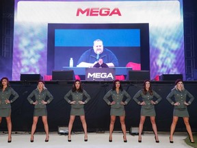Megaupload founder Kim Dotcom (C) launches his file-sharing site Mega in Auckland in this Jan. 20, 2013 file photo. REUTERS/Nigel Marple/Files