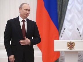 Russian President Vladimir Putin takes part in a state awards ceremony in Moscow's Kremlin March 24, 2014. REUTERS/Alexei Nikolskiy/RIA Novosti/Kremlin