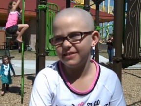 Kamryn Redfro shaved her head to support her best friend who is fighting cancer and was told she couldn't go to school because the haircut violated the dress code. (Screengrab from 9 News video.)