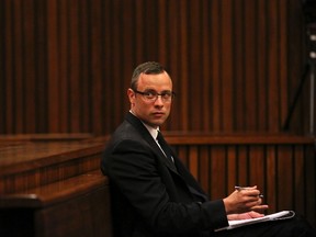 Olympic and Paralympic track star Oscar Pistorius sits in the dock during his trial for the murder of his girlfriend Reeva Steenkamp, at the North Gauteng High Court in Pretoria March 25, 2014. (REUTERS)