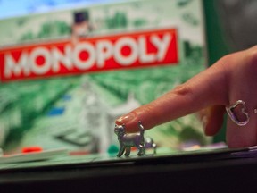 The newest Monopoly token, the cat, is seen at Hasbro's New York office in New York, in this February 11, 2013 file photo.  (REUTERS/Andrew Kelly/Insider Images)