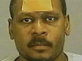 Former NBA player Mookie Blaylock is seen in a mugshot.