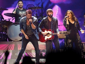 Lady Antebellum, including Charles Kelley (left), Dave Haywood (centre), and Hillary Scott touring North America on their Take Me Downtown tour. They're the headliners at the 2014 Ottawa Bluesfest on Sunday, July 6 at 9:15 p.m. 
Ian Kucerak/Edmonton Sun/QMI Agency