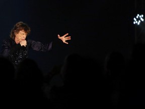 Mick Jagger of the Rolling Stones performs during their 14 on Fire concert at Marina Bay Sands in Singapore March 15, 2014. (REUTERS/Tim Chong)