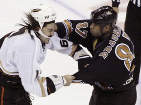 Washington Capitals' Donald Brashear lands a punch to the side of the head of George Parros of the Anaheim Ducks during their fight on December 8, 2006. (REUTERS/Joe Giza)