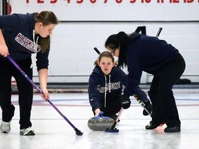 Marymount Regals skip Krysta Burns (centre) releases a rock during the SDSSAA city curling championships at the Sudbury Curling Club on Feb. 19. Burns won the city title that day, advanced to win the NOSSA title a week later and last week wrapped up her high school curling career with the OFSAA championship title. Burns is this week's Cambrian College/Sudbury Star GameChanger award winner for her stellar performance at OFSAA.