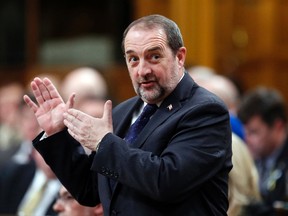 Canada's Infrastructure Minister Denis Lebel speaks during Question Period in the House of Commons on Parliament Hill in Ottawa March 24, 2014. (REUTERS/Chris Wattie)
