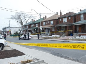 Toronto Police at the scene of a fatal shooting on Symington Ave. in the west end Tuesday, March 25, 2014. (Victor Biro photo)