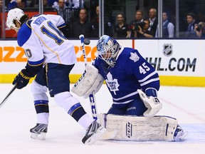 Jonathan Bernier of the Toronto Maple Leafs stops Brenden Morrow of the St. Louis Blues during NHL action in Toronto on March 25, 2014. (Dave Abel/Toronto Sun)