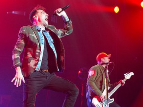 Energetic Jacob Hoggard of the band Hedley, which is nominated for four Juno Awards this year, thrills fans during the band?s performance Tuesday at Budweiser Gardens. (CRAIG GLOVER, The London Free Press)