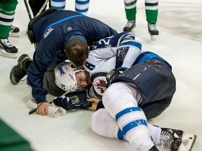 Mar 24, 2014; Dallas, TX, USA; Winnipeg Jets right wing Blake Wheeler (26) is injured during the third period against the Dallas Stars at the American Airlines Center. The Stars defeated the Jets 2-1. Mandatory Credit: Jerome Miron-USA TODAY Sports