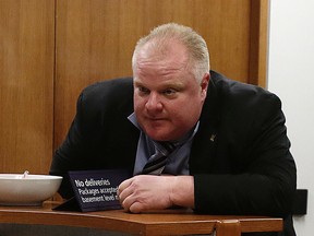 Mayor Rob Ford talks with his receptionist outside of his office on Wednesday, March 19, 2014. Craig Robertson/Toronto Sun/QMI Agency