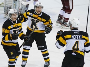 Kingston Frontenacs’ Robert Polesello, left, celebrates a goal with Darcy Greenaway, middle, and Michael Moffat against the Petes during Game 3 of an OHL Eastern Conference quarter-final playoff series in Peterborough on Tuesday night. (Clifford Skarstedt/QMI Agency)
