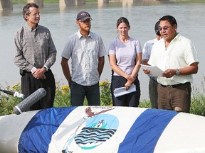 George Poitras, right, a Mikisew Cree First Nations councillor and former chief, speaks during a press event at Pembina Institute's Athabasca River Expedition at Fort McMurray, Alberta in this August 3, 2007 file photo. Poitras said the oilsands development have had a "disturbing impact" on the environment and the community of Fort Chipewyan. (Carl Patzel/QMI Agency files)