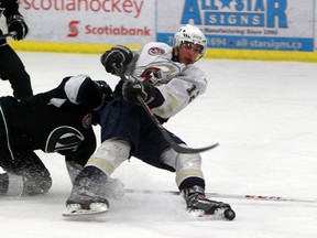 Dylan Hollman of the Spruce Grove Saints gets tripped on a breakaway in Game 7 of the AJHL division playoff series against the Sherwood Park Crusaders in Spruce Grove on Tuesday. (AARON TAYLOR/Edmonton Sun)