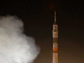 The Soyuz TMA-12M spacecraft carrying International Space Station (ISS) crew of U.S. astronaut Steven Swanson and Russian cosmonauts Alexander Skvortsov and Oleg Artemyev blasts off from its launch pad at the Baikonur cosmodrome March 26, 2014. (REUTERS/Maxim Shemetov)