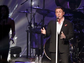 Johnny Reid sings during a concert at the Northern Jubilee Auditorium at the University of Alberta in Edmonton, Alta., on Saturday, Nov. 23, 2013. (Ian Kucerak/QMI Agency)