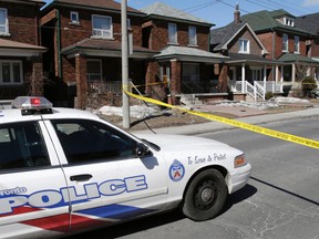 The scene where a man was found fatally shot on Symington Ave. around 5:45 p.m. on March 25, 2014. Police were still investigating the next day. (Craig Robertson/Toronto Sun)