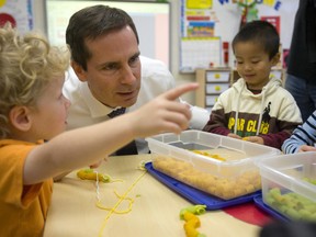 Then-Ontario premier Dalton McGuinty is pictured in this file photo touring a  London, Ont. public school, getting a closeup look at their eight all-day kindergarten classes. (QMI Agency files)