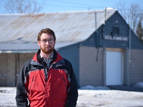 Ben Morris stands in front of one of the barns in the southwest corner of the Memorial Centre grounds. According to his research, a three-story high school could sit comfortably in this location, without affecting any of the other facilities — except maybe a few parking spots.
Michelle Ferguson/For the Whig-Standard