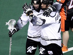 Adrian Sorichetti celebrates one of his three goals against the Buffalo Bandits last weekend with Rush teammate Curtis Knight. (David Bloom, Edmonton Sun)